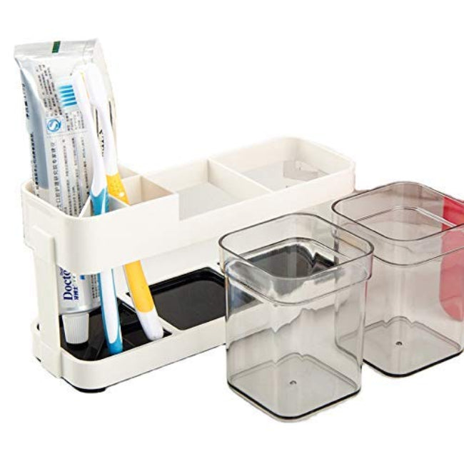 2-cup toothbrush and toothpaste stand holder, plastic bathroom storage organizer keeping two sets of items upright and dry on a vanity