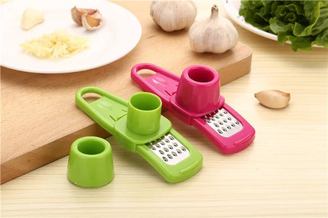 Multi-functional garlic crusher, grinder, and slicer tool, showing the all-in-one kitchen mincer being used to prepare cloves