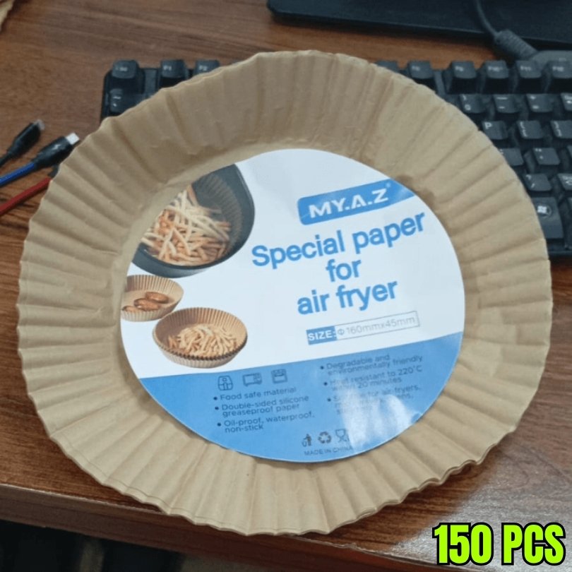 MY.A.Z special paper for air fryer on a desk with a keyboard in the background