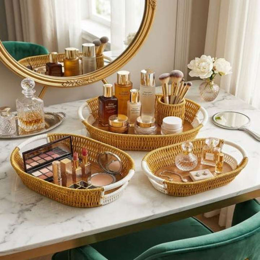 Makeup and perfume set on a marble table with a decorative mirror.