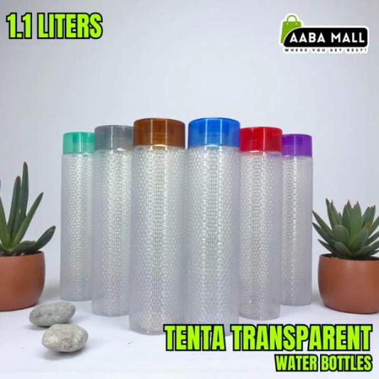 Transparent water bottles with colored lids on a white background with plants and stones.