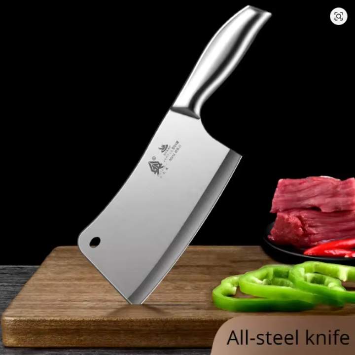 Stainless steel cleaver knife on a wooden cutting board with vegetables and meat in the background.