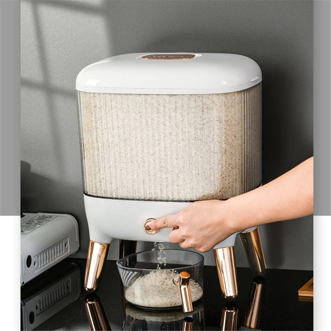 Large 12KG airtight plastic rice and grain storage box with a white lid and transparent body, shown sitting on a kitchen counter next to a scoop, filled with white rice.