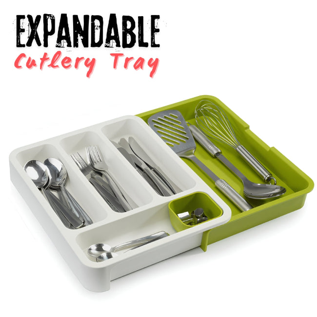 Expandable 2-tier plastic cutlery tray organizer shown fully extended in a kitchen drawer, neatly separating spoons, knives, and forks in the multiple layered compartments.