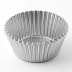 Metallic muffin tin on a white background