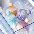Colorful bottles labeled 'Ice-Ball' on a bed of ice cubes.