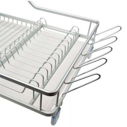 Metal dish rack with cutlery on a white background
