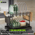 2-tier dish drying rack with kitchen utensils and dishes on a kitchen counter.