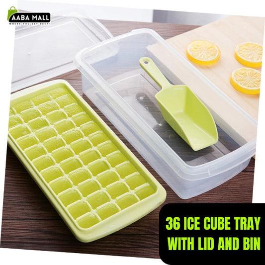 Green ice cube tray with lid and bin on a wooden surface, featuring a green scoop.