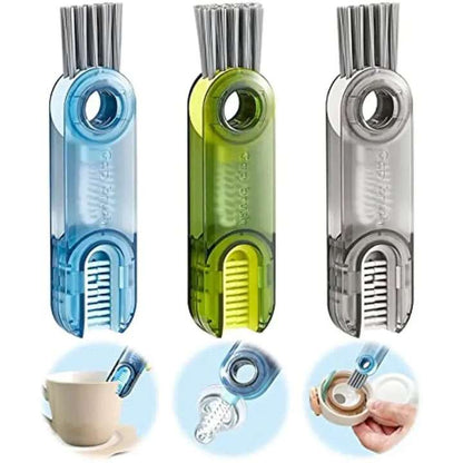 Three kitchen scrubber tools with different colored handles on a white background.