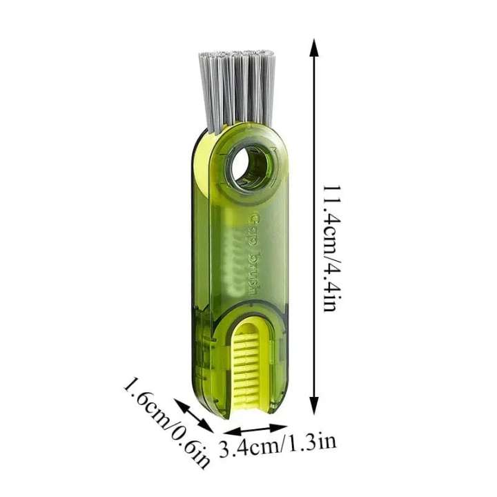 Green fishing hook cleaner with measurements on a white background