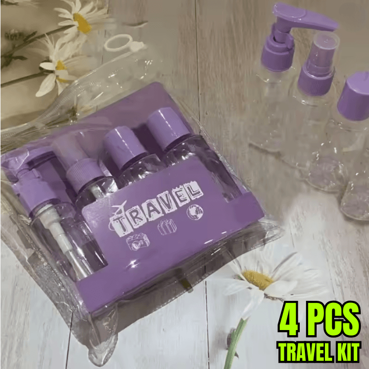 Purple travel kit with four bottles on a wooden surface with flowers.