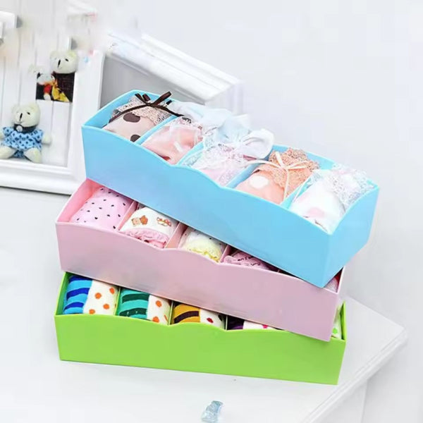 Wardrobe storage box with compartments for ties and cosmetics