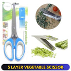 5-layer vegetable scissors with blue handles, shown with green vegetables and a comb on a white background.