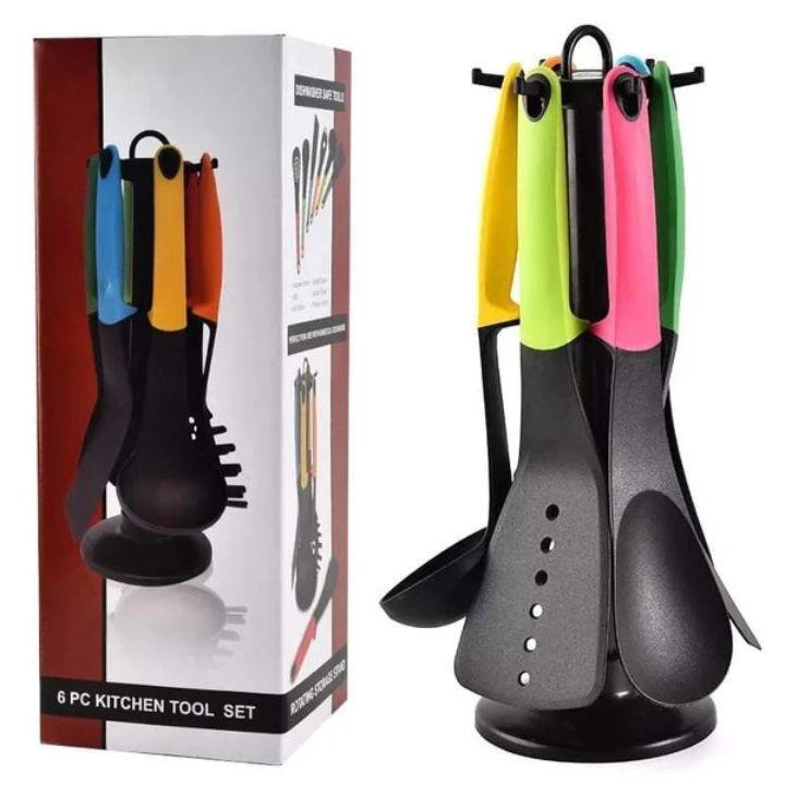 Colorful kitchen utensils on a stand with packaging in the background