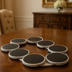 Set of round coasters on a wooden table with a blurred background