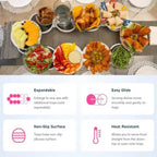 Diverse food items on a table with features of expandable, easy glide, non-slip surface, and heat resistant trays displayed below.