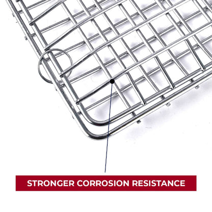 A non-stick metal BBQ grill basket with a long, light-colored wooden handle, shown closed and ready for grilling vegetables or fish.