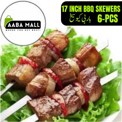 A close-up shot of a set of 6 flat, 17-inch stainless steel BBQ skewers resting on a wooden picnic table, suitable for shish kabobs and grilling.