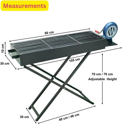 A black portable charcoal BBQ grill with a stand, showing the side-mounted manual hand-crank blower fan integrated into the unit.