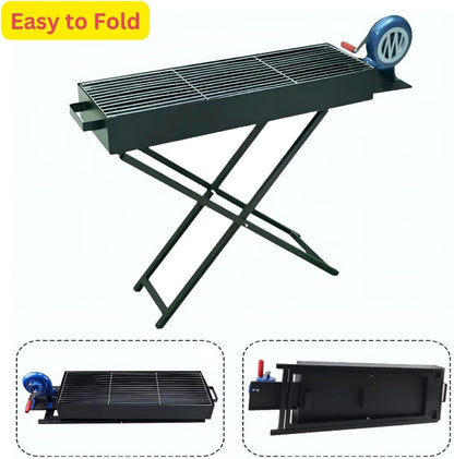 A black portable charcoal BBQ grill with a stand, showing the side-mounted manual hand-crank blower fan integrated into the unit.