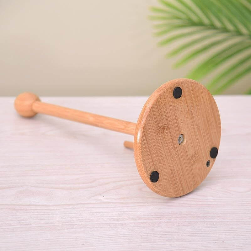 Wooden tool with a handle on a light surface