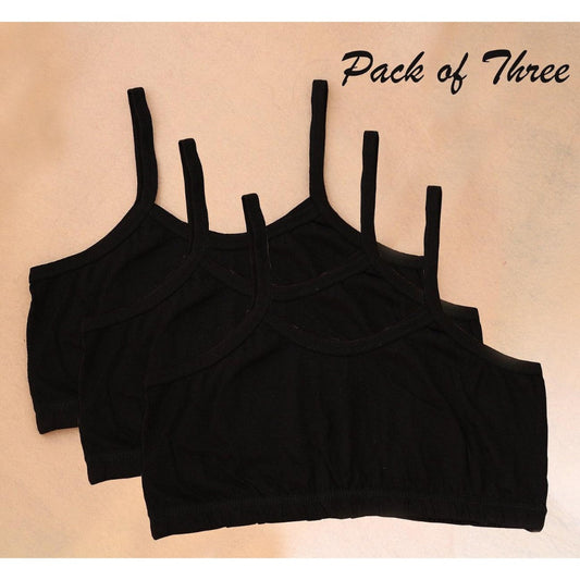 Pack of three black crop tops on a beige background