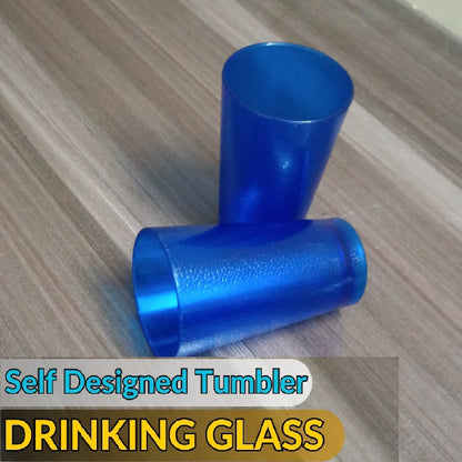 Image of six blue 300ML food-grade plastic tumblers with a vertical ribbed pattern, shown filled with ice and water on a sunny outdoor table.