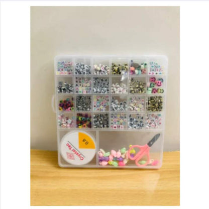 Clear plastic organizer with compartments filled with small items on a wooden surface.
