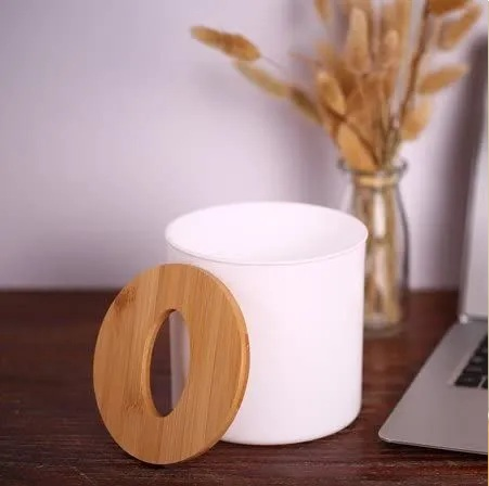 Circular tissue box with plastic body and wood top