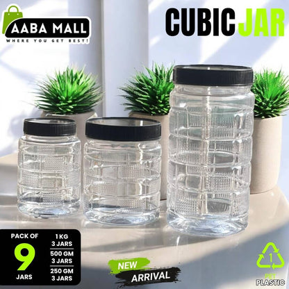 Clear cubic jars with black lids on a white surface with plants in the background, featuring Aaba Mall branding.