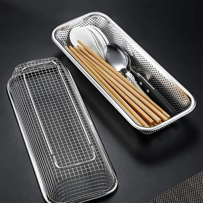 Metal mesh travel case with cutlery and chopsticks on a dark background