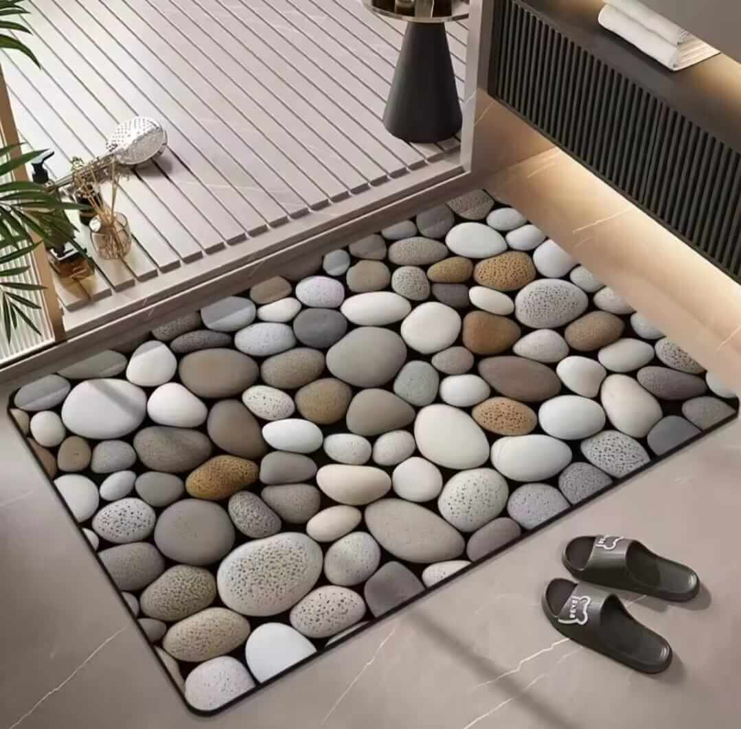 Decorative pebble-patterned rug on a floor with slippers nearby