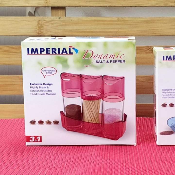 Imperial Dynamic salt and pepper shaker set packaging on a pink surface with wooden background