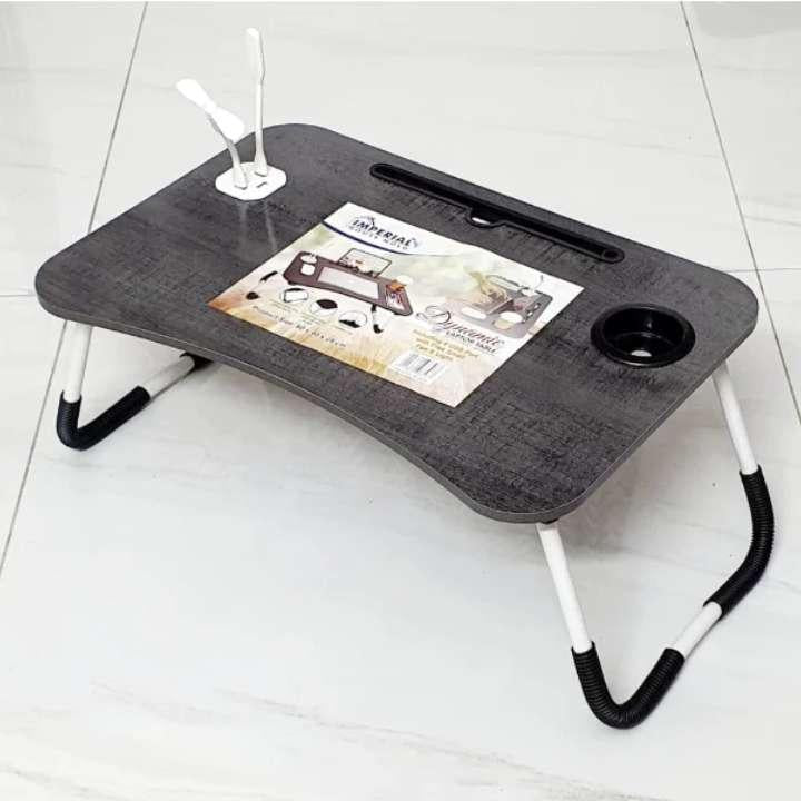 Portable lap desk with cup holder and tablet stand on a white floor