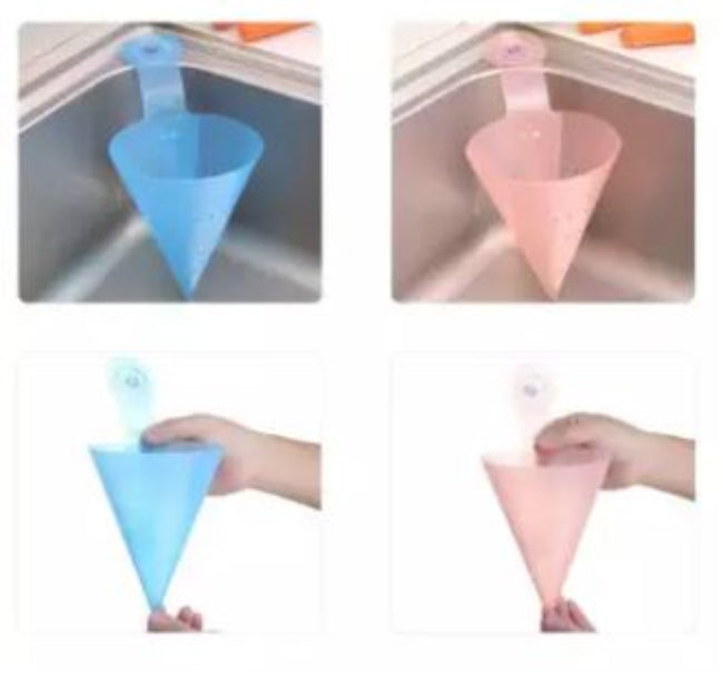 Foldable plastic triangle kitchen sink strainer basket, shown attached to the corner of a kitchen sink, draining water from freshly washed vegetables.