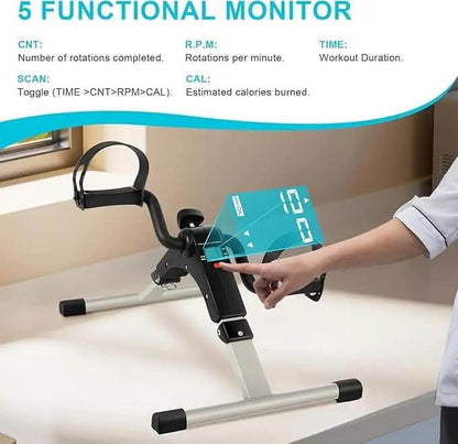 Hand using a digital device on a small exercise bike with fitness monitor features displayed.