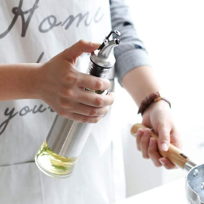 Stainless steel covered glass oil bottle for countertop use