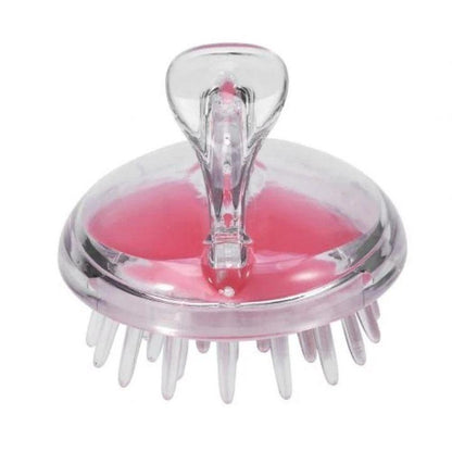 A clear plastic and transparent silicone scalp massager with pink silicone massage pads on a white background.