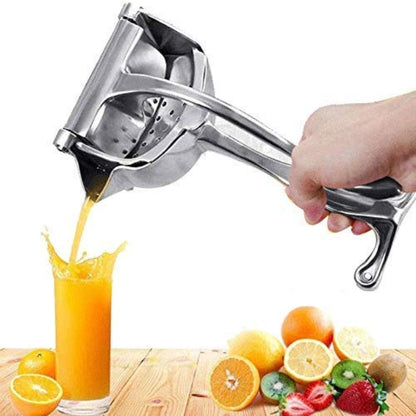 Heavy-duty stainless steel manual hand squeeze juicer press, shown extracting fresh orange juice into a glass, highlighting the stable base and lever mechanism.
