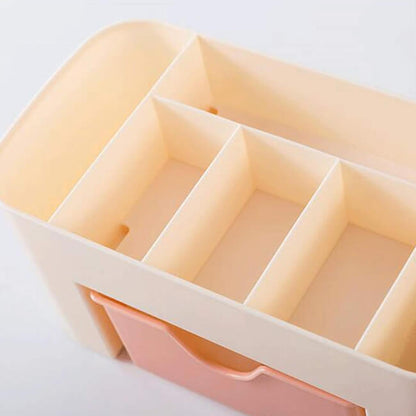 Pink and beige storage basket with compartments on a white background