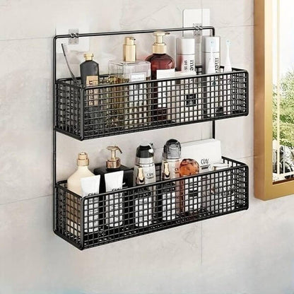 Black metal wall-mounted storage baskets with bathroom products on a tiled wall.