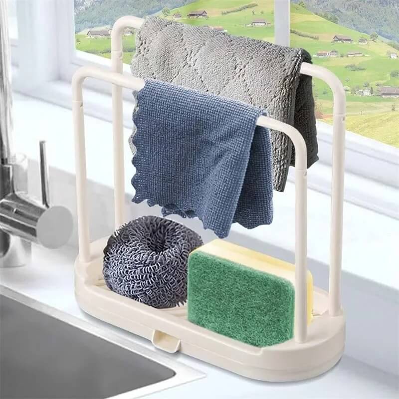 Kitchen rack with cleaning items including a sponge, scrubber, and cloths on a kitchen counter.