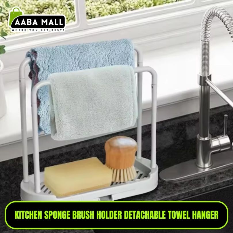 Kitchen sponge brush holder with detachable towel hanger on a kitchen counter.
