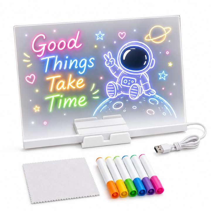Light-up board with astronaut design, markers, and cleaning cloth on a white background