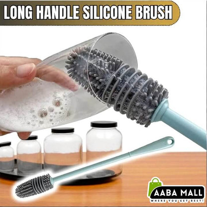 Long handle silicone brush being used to clean a bottle with AABA MALL branding.