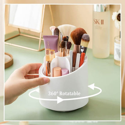 White makeup brush holder with various brushes and products on a light green surface, labeled '360° Rotatable'.