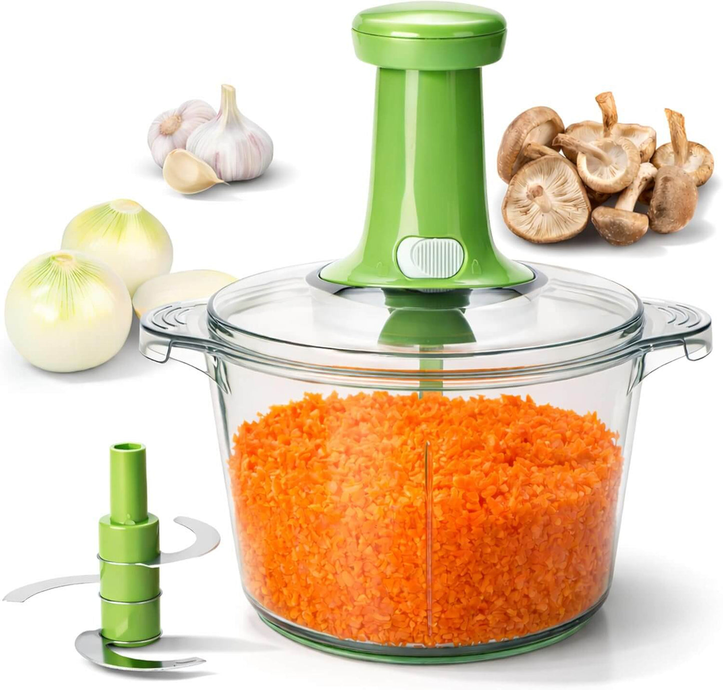 Green manual vegetable chopper with a clear container filled with shredded carrots, surrounded by vegetables on a white background.