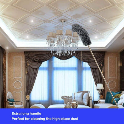 Chandelier in a room with curtains and a long cleaning tool.
