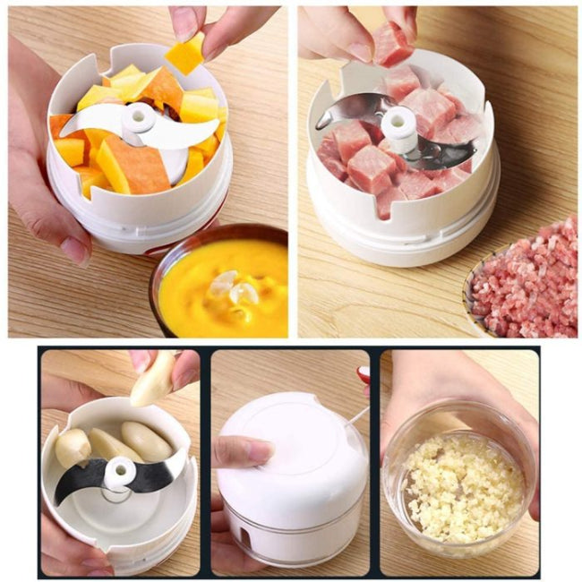 Mini hand manual food chopper and mincer with pull-cord mechanism, showing chopped garlic inside the portable vegetable dicer